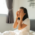 woman with pain in eyes and head